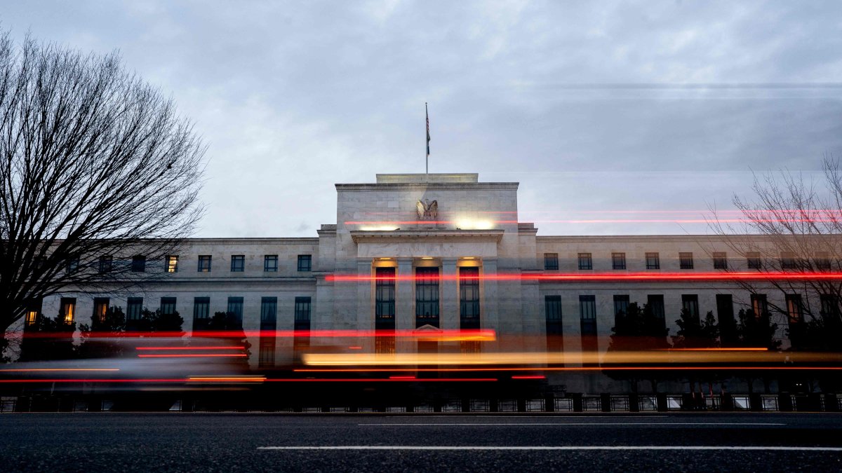 Vehicles drive past the Marriner S. Eccles Federal Reserve building, Washington, U.S., Jan. 25, 2022. (AFP Photo)