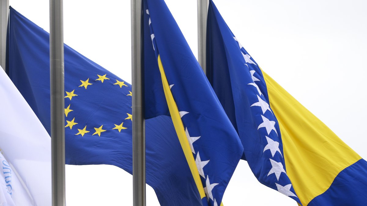 European Union flag flutters next to the flag of Bosnia-Herzegovina in front of the Council of Ministers building in Sarajevo, Tuesday, March 12, 2024. (AP File Photo)