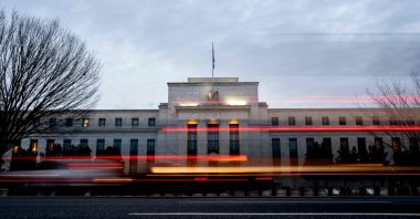 Vehicles drive past the Marriner S. Eccles Federal Reserve building, Washington, U.S., Jan. 25, 2022. (AFP Photo)