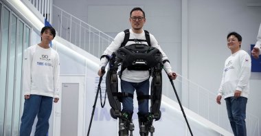 Kim Seung-hwan, who is himself a paraplegic and part of the Exoskeleton Laboratory team, demonstrates the prototype of the exoskeleton robot &quot;WalkON Suit F1,&quot; Daejeon, South Korea, Nov. 27, 2024. (Reuters Photo)