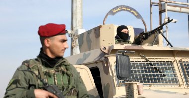 A member of the PKK/YPG terrorist group stands along a street after anti-regime forces seized the capital and ousted Bashar Assad, Hassakeh, Syria, Dec. 11, 2024. (Reuters Photo)