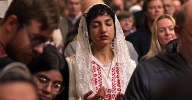 Worshippers pray during the Christmas midnight Mass at the Catholic Church of Saint Catherine, in the Nativity Church Complex, in the biblical city of Bethlehem in the occupied West Bank, Palestine, Dec. 25, 2024. (AFP Photo)
