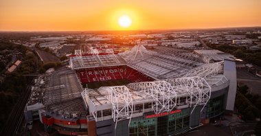 An aerial drone view of Manchester United Football Club Old Trafford Stadium at sunset, Manchester, U.K., Sept. 22, 2024. (Shutterstock Photo)