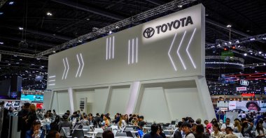 Visitors and salespeople sit inside a Toyota booth at the 41st Thailand International Motor Expo, Bangkok, Thailand, Nov. 29, 2024. (Reuters Photo)