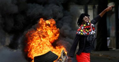 A protester reacts near a burning barricade during a &quot;national shutdown&quot; against the election outcome, at Luis Cabral township in Maputo, Mozambique, Nov. 7, 2024. (Reuters Photo)