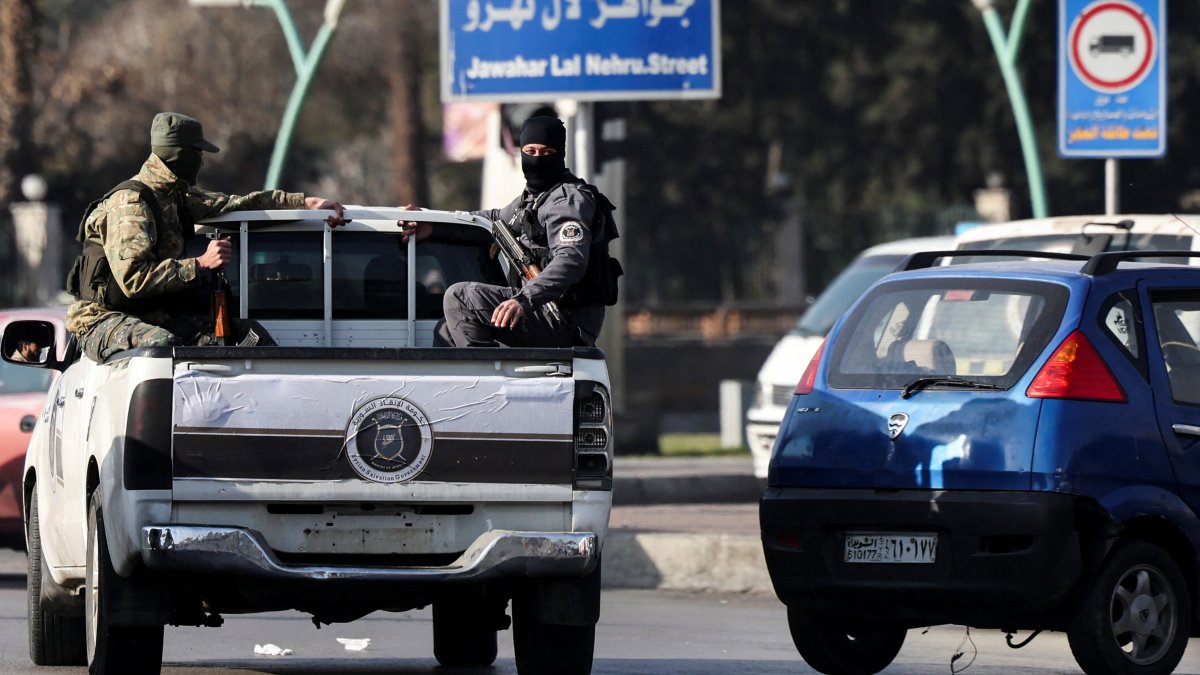 Syrian security forces members patrol in a vehicle, Damascus, Syria, December 26, 2024. (Reuters Photo)