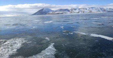 The frozen surface of Balık Lake, surrounded by snow-covered mountains, in Ağrı, Türkiye, Dec. 26, 2024. (IHA Photo)