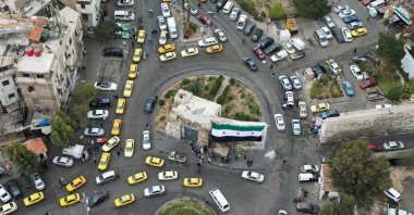 A drone view shows the new flag of post-Assad Syria in the Bab Touma neighborhood, Damascus, Syria, Dec. 22, 2024. (Reuters Photo)
