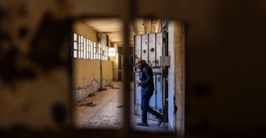 A Syrian man inspects cells at the prison of Sednaya, north of Damascus, Syria, Dec. 16, 2024. (AFP Photo)