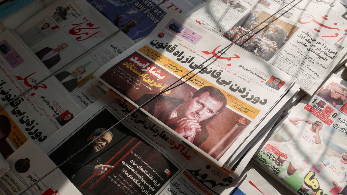 A picture of Syrian regime leader Bashar Assad is seen on a newspaper being sold at a newspaper stand, Tehran, Iran, Dec. 8, 2024. (WANA Photo)