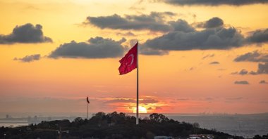 The Turkish flag waves on Çamlıca Hill during a golden sunset, Istanbul, Türkiye, Oct. 27, 2024. (Shutter Stock Photo)