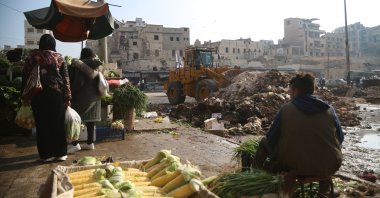An excavator cleans debris from a damaged building as a part of a reparation campaign in Aleppo, Syria, Dec. 25, 2024. (EPA Photo)