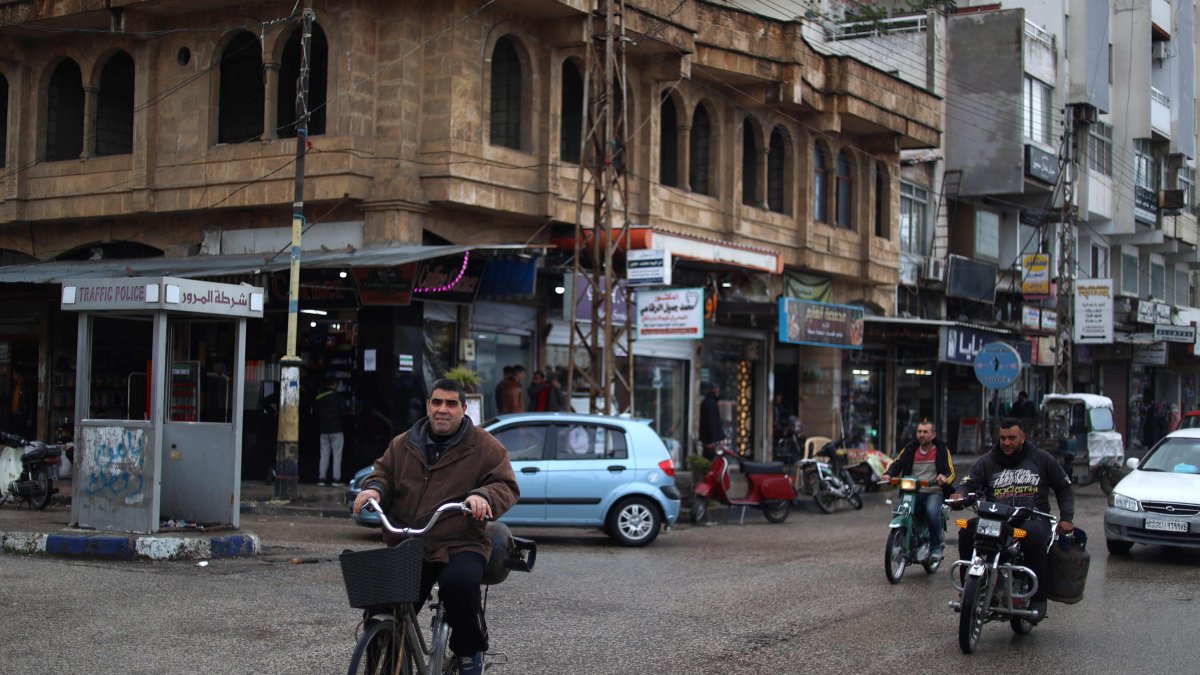 People commute in the town of Jableh, northwest of the Syrian capital Damascus, Syria, Dec. 28, 2024. (AFP Photo)