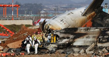 Firefighters work at the wreckage of the Jeju Air aircraft at Muan International Airport in Muan, South Korea, Dec. 29, 2024. (EPA Photo)