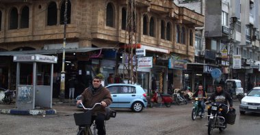 People commute in the town of Jableh, northwest of the Syrian capital Damascus, Syria, Dec. 28, 2024. (AFP Photo)
