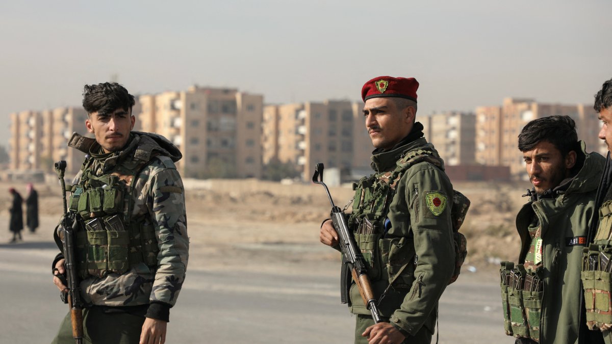 PKK/YPG terrorists stand along a street after anti-regime forces seized the capital and ousted Bashar Assad, Hasakah, Syria, Dec. 11, 2024. (Reuters Photo)