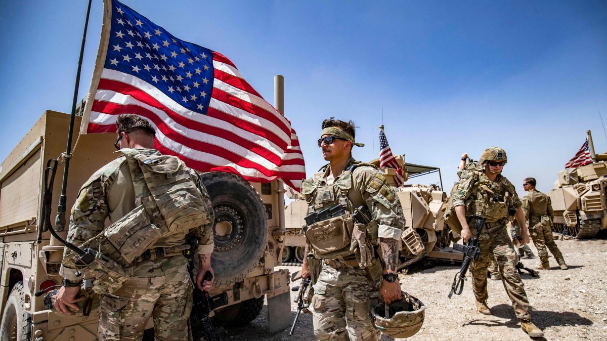 U.S. soldiers patrol the countryside of Rumaylan, occupied by PKK/YPG terrorists, northeastern Hasakeh province, Syria, June 7, 2023. (AFP Photo)