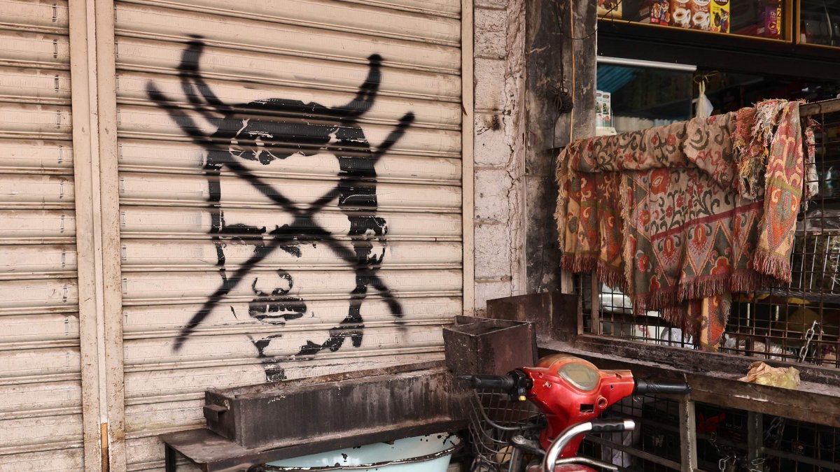 A picture shows a defaced graffiti of toppled Syrian dictator Bashar Assad in Damascus, Syria, Dec. 28, 2024. (AFP Photo)