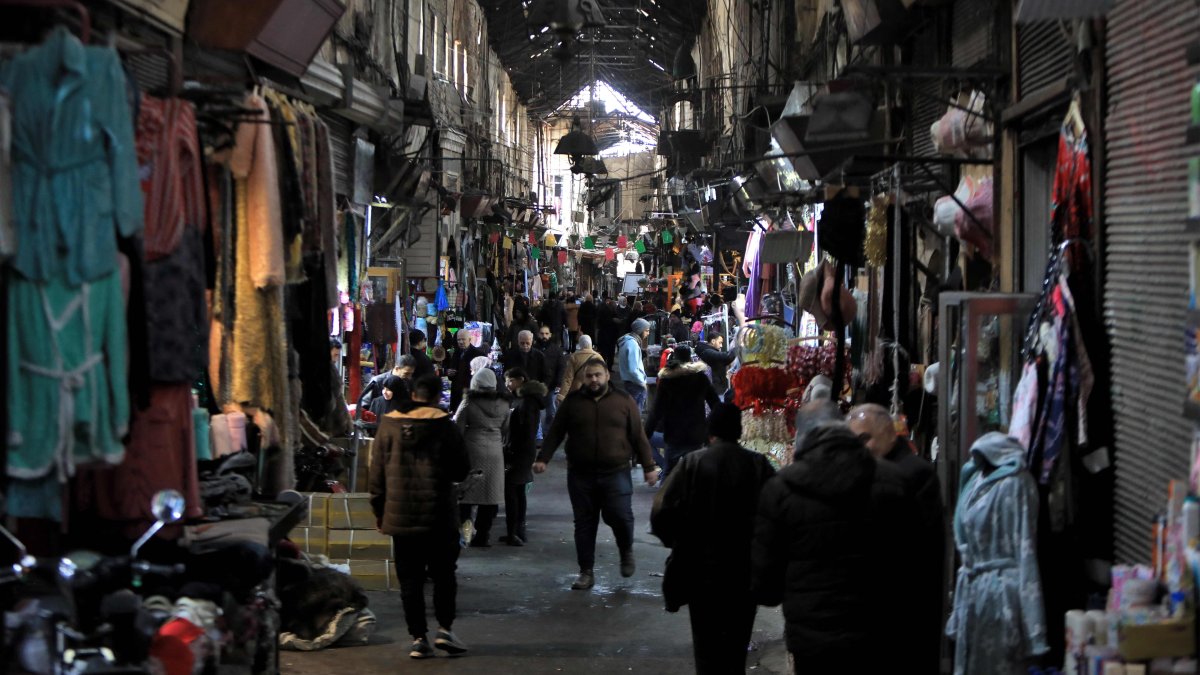 People walk in the Medhat Pasha market in the old part of the capital Damascus, Syria, Dec. 28, 2024. (AFP Photo)