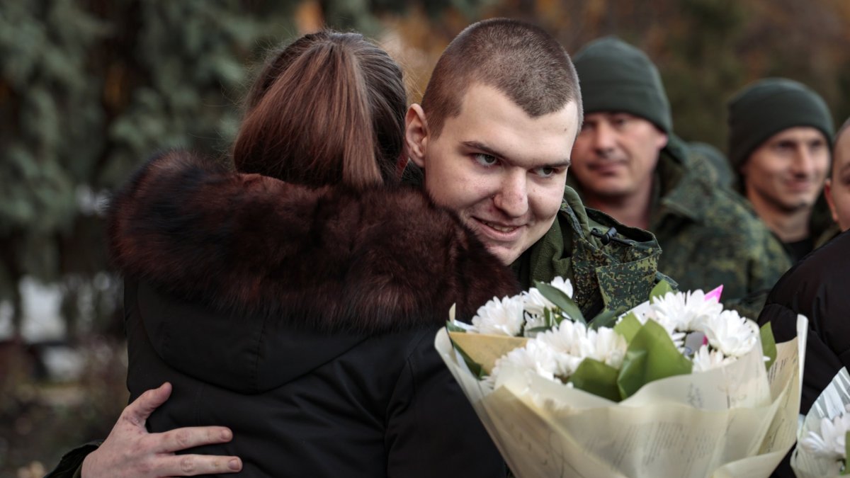 A former prisoner of war meets with relatives after his release from Ukrainian captivity in Ukraine, in Amvrosievka, Donetsk region, Ukraine, Nov. 1, 2022. (EPA File Photo)