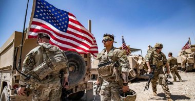 U.S. soldiers patrol the countryside of Rumaylan, occupied by PKK/YPG terrorists, northeastern Hasakeh province, Syria, June 7, 2023. (AFP Photo)