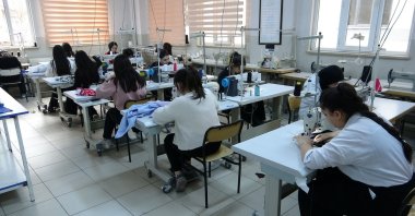 Students in the Fashion Design Department sew clothes for those in need, Van, Türkiye, Dec. 30, 2024. (IHA Photo)