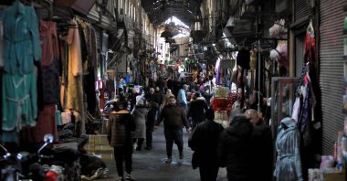 People walk in the Medhat Pasha market in the old part of the capital Damascus, Syria, Dec. 28, 2024. (AFP Photo)