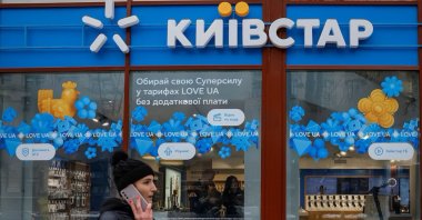 A woman walks past a store of Ukraine&#039;s telecommunications company Kyivstar in Kyiv, Ukraine, Dec. 12, 2023. (Reuters Photo)
