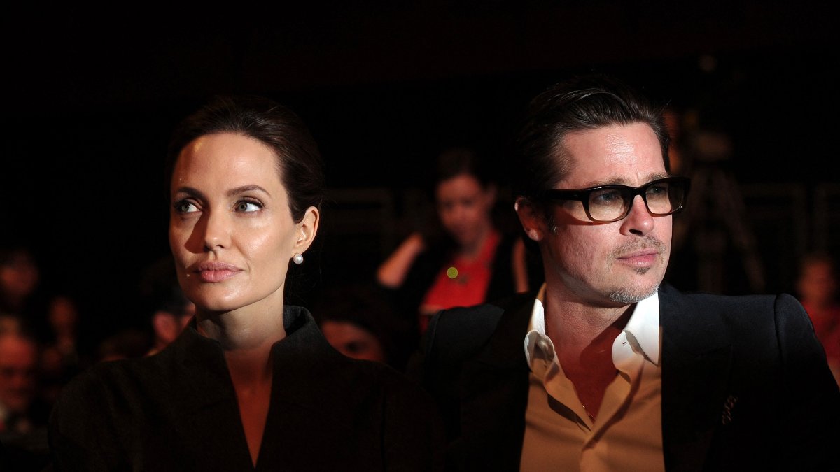 U.S. actress and special U.N. envoy Angelina Jolie (L) and her husband U.S. actor Brad Pitt attend the fourth day of the Global Summit to End Sexual Violence in Conflict, London, U.K., June 13, 2014. (AFP Photo)