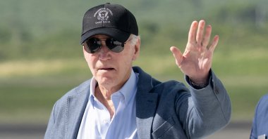 U.S. President Joe Biden waves as he disembarks from Air Force One in Christiansted, St. Croix, on the U.S. Virgin Islands, Dec. 26, 2024. (AFP Photo)