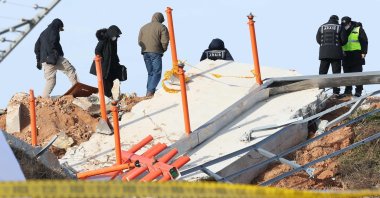 Investigators from ARAIB, NTSB, and Boeing examine the crash site of a Jeju Air Boeing 737-800 at Muan Airport, South Korea, Dec. 31, 2024. (AFP Photo)