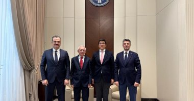 Kyrgyz Cabinet of Ministers&#039; Deputy Chairman Edil Baisalov (2nd R) and the Turkish Maarif Foundation&#039;s Kyrgyzstan Coordinator Hüsnü Bircan (R) pose after holding a meeting at the presidential palace in Bishkek, Kyrgyzstan, Dec. 31, 2024. (AA Photo)