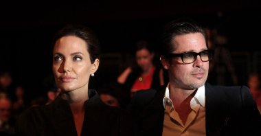 U.S. actress and special U.N. envoy Angelina Jolie (L) and her husband U.S. actor Brad Pitt attend the fourth day of the Global Summit to End Sexual Violence in Conflict, London, U.K., June 13, 2014. (AFP Photo)