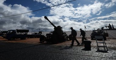  Israeli soldiers walk next to military weapons displayed for the media at Amiad military camp, northern Israel, Dec. 31, 2024. (EPA Photo)