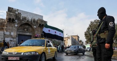 Members of the Syrian Salvation Government stand guard on New Year's Eve at the Bab Touma Square, in Damascus, Syria, Dec. 31, 2024. (Reuters Photo)