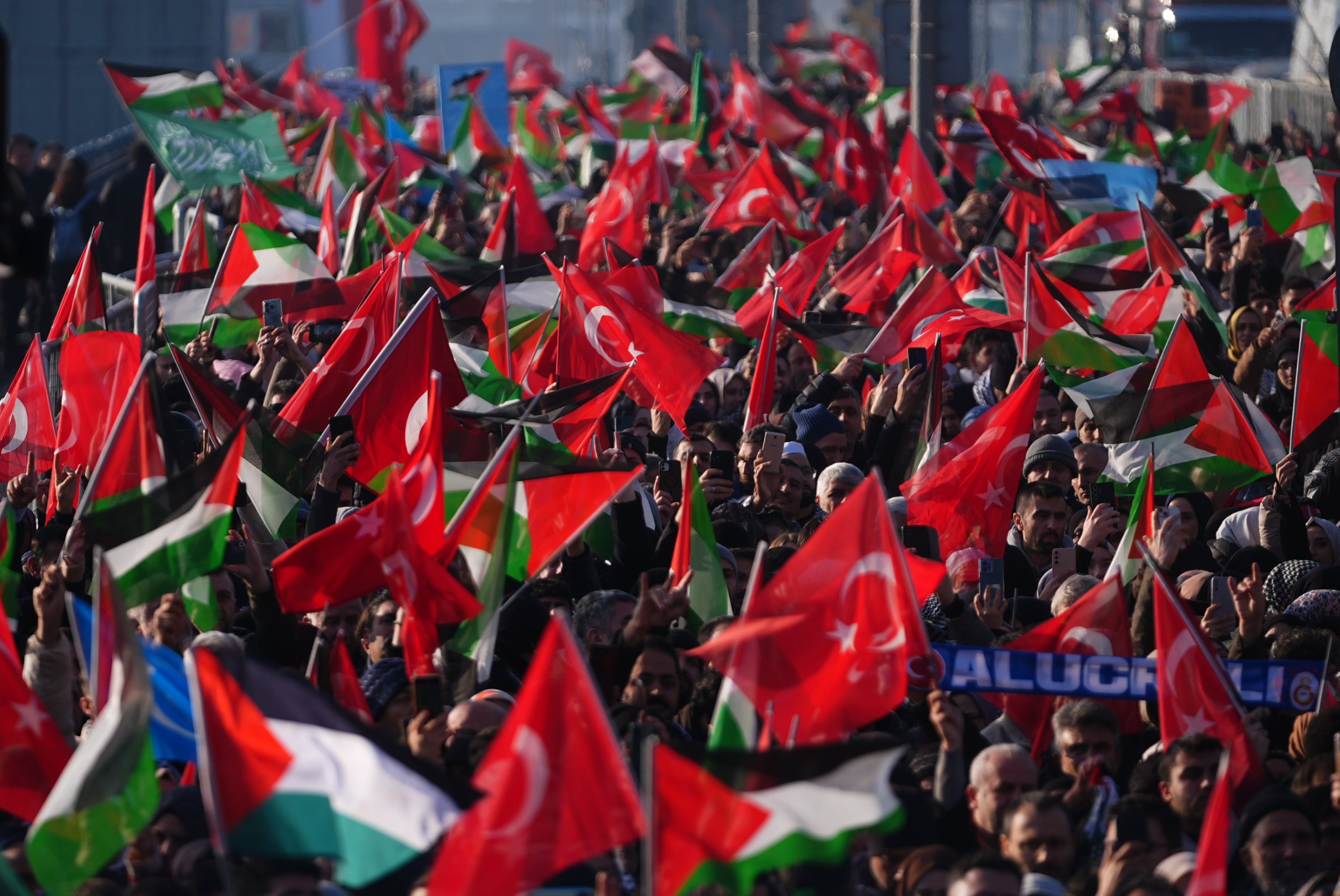 People waving flags at the rally, in Istanbul, Türkiye, Jan. 1, 2025. (AA Photo) 