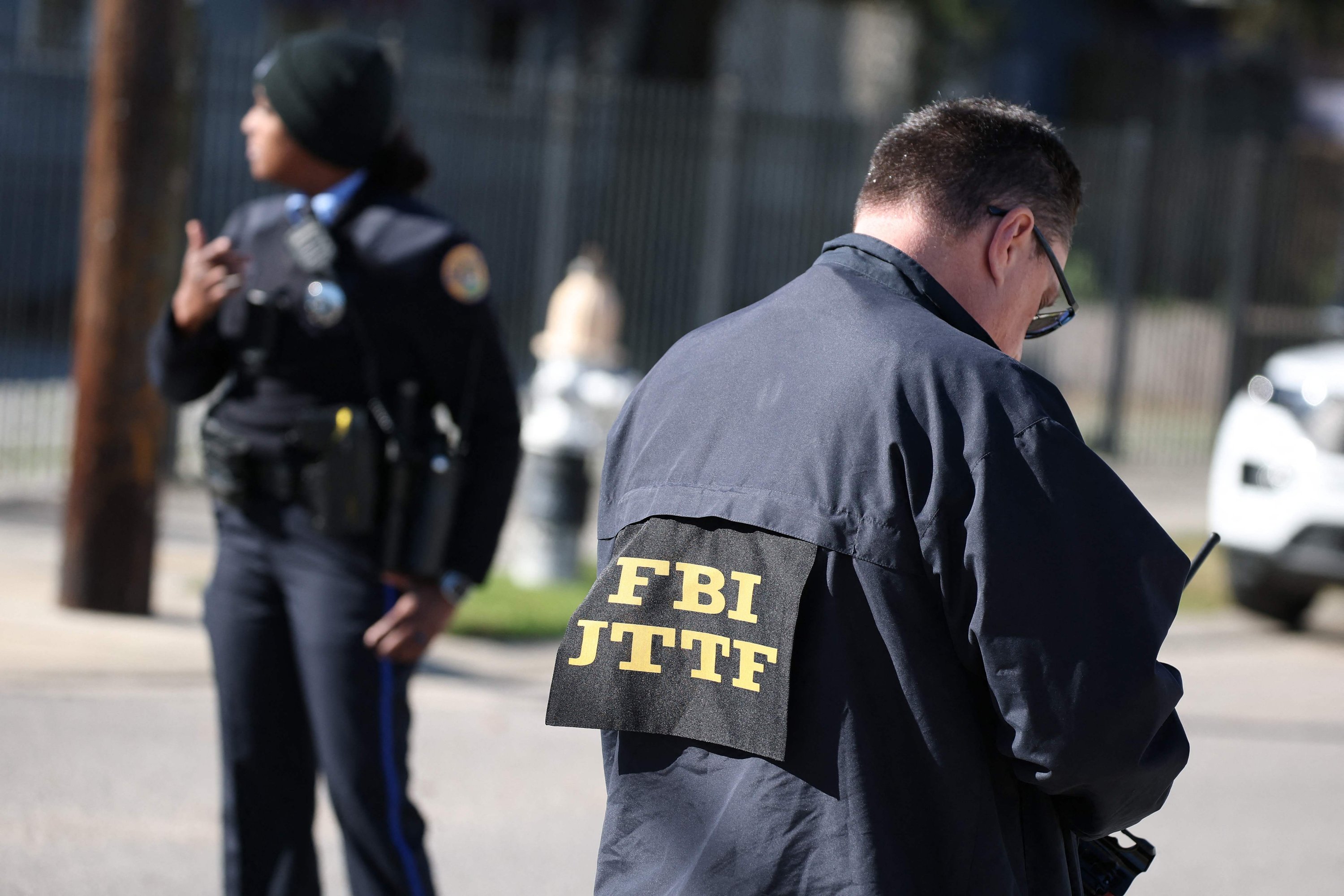 FBI officials and New Orleans Police are seen outside a house fire on Mandeville Street that may be connected to the mass casualty Bourbon Street attack where at least 10 people were killed when a person allegedly drove into the crowd in the early morning hours of New Year's Day, in New Orleans, Louisiana, U.S., Jan. 1, 2025. (AFP Photo)