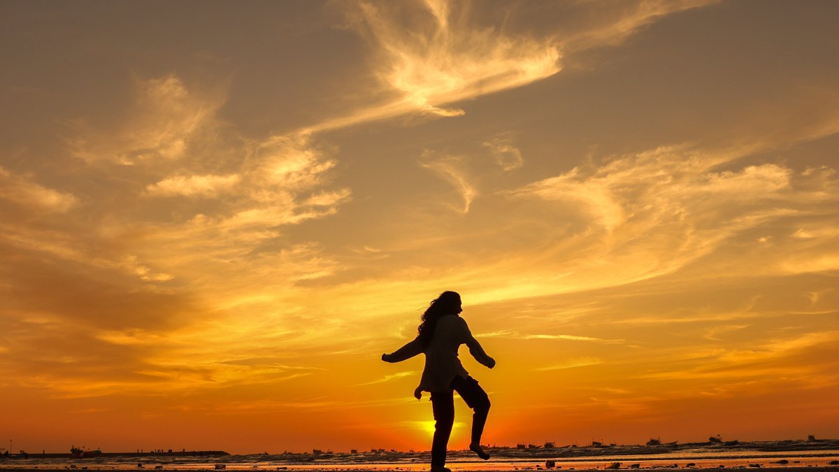 A person walks along Gorai Beach at sunset, Mumbai, India, Dec. 9, 2024. (EPA Photo)