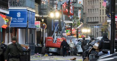 Police investigators surround a white truck that crashed into a work lift after plowing through a crowd in the French Quarter of New Orleans, Louisiana, U.S., Jan. 1, 2025. (AFP Photo)