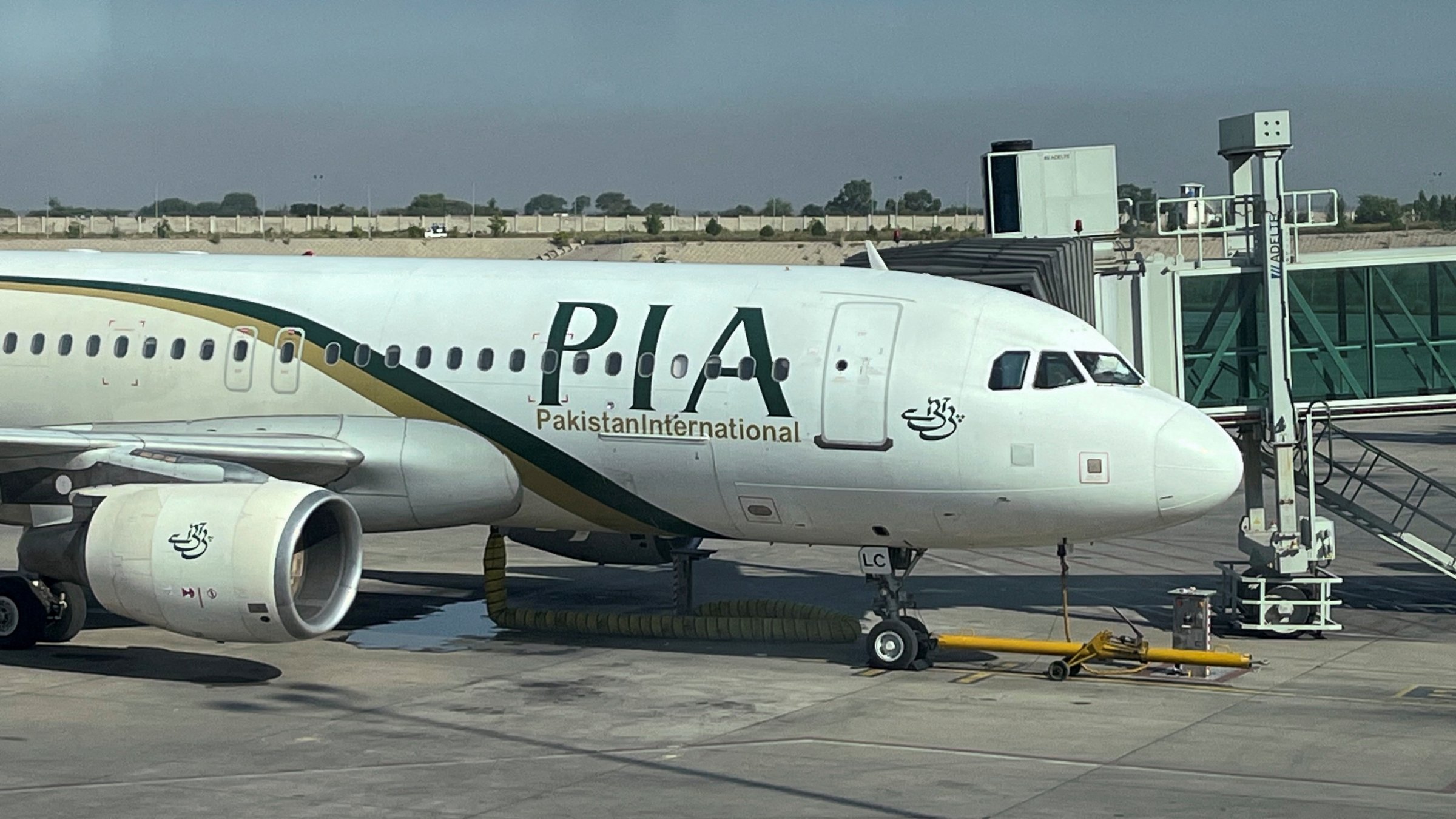 A view of the Pakistan International Airlines (PIA) passenger plane, taken through a glass panel, at Islamabad International Airport, Pakistan, Oct. 3, 2023. (Reuters Photo)