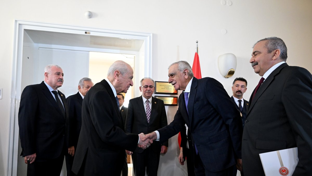 Nationalist Movement Party (MHP) leader Devlet Bahçeli (2nd L) shakes hands with Ahmet Türk, a member of the Peoples’ Equality Party (DEM Party) delegation, Ankara, Türkiye, Jan. 2, 2024. (AA Photo)