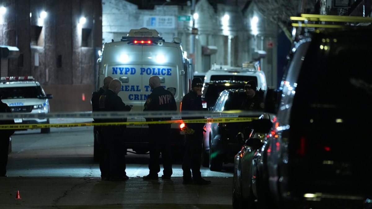 Officers of the New York Police Department are seen at the location where a shooting injured 10 people in Queens, New York City, U.S., Jan. 1, 2025. (AA Photo)