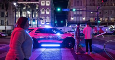 People look at a blocked-off road from Canal Street after at least 15 people were killed on Bourbon Street, after an attack early in the morning, New Orleans, Louisiana, U.S., Jan. 1, 2025. (AFP Photo)
