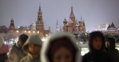 People walk outside the Kremlin on New Year's Eve, Moscow, Russia, Dec. 31, 2024. (EPA Photo)