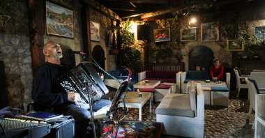Bosnian musician Enes Salman plays the accordion while performing the traditional love song Sevdalinka, Sarajevo, Bosnia-Herzegovina, Dec. 20, 2024. (Reuters Photo)