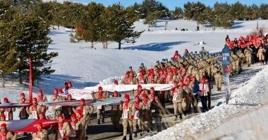 Soldiers march with banners as part of a Ministry of Youth and Sports event organized to remember the thousands of soldiers lost during the World War I Sarıkamış campaign, Türkiye, Jan. 1, 2025. (IHA Photo)