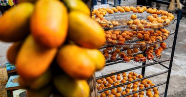 Persimmons dry on racks at Weiweijia persimmon farm in Xinpu township, Hsinchu county, Taiwan, Nov. 14, 2024. (AFP Photo)