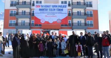 Women receive the keys to their new homes in front of the newly built apartment complex, Van, Türkiye, Jan. 2, 2025. (AA Photo)