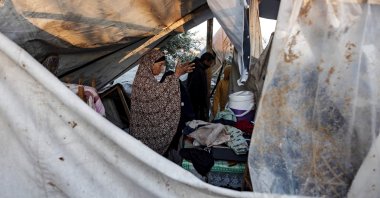 People inspect damages after an Israeli airstrike targeted a camp for war-displaced people, al-Mawasi area, Khan Younis, southern Gaza Strip, Palestine, Jan. 2, 2025.