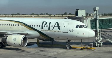 A view of the Pakistan International Airlines (PIA) passenger plane, taken through a glass panel, at Islamabad International Airport, Pakistan, Oct. 3, 2023. (Reuters Photo)